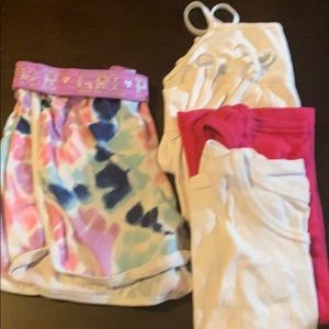 A pair a shorts and 4 tank tops.